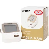 Thân máy Omron JPN750 đặt cạnh vỏ hộp sản phẩm ghi rõ xuất xứ Nhật Bản